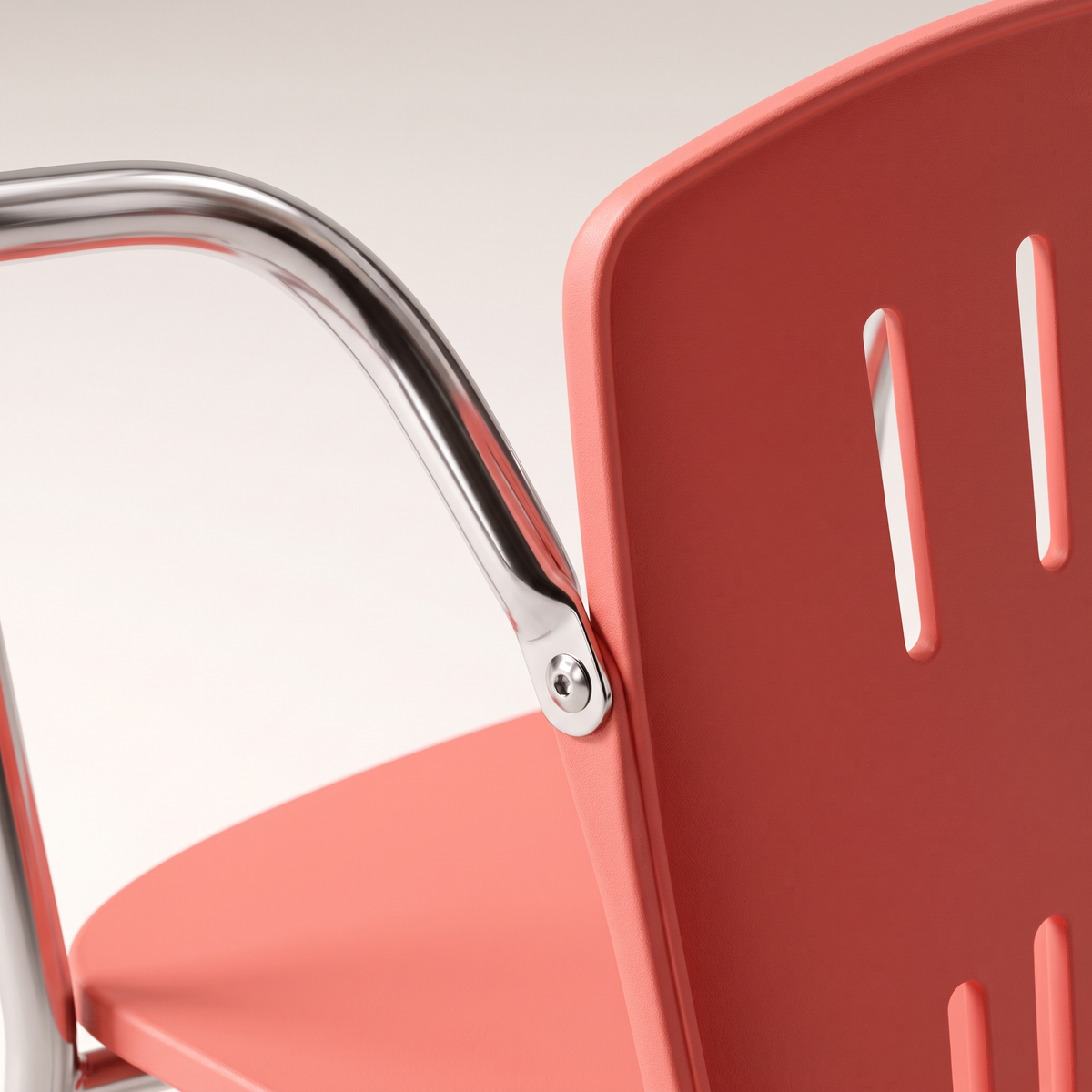 Coral Pink Molded Chair with Chrome Armrests, material detail