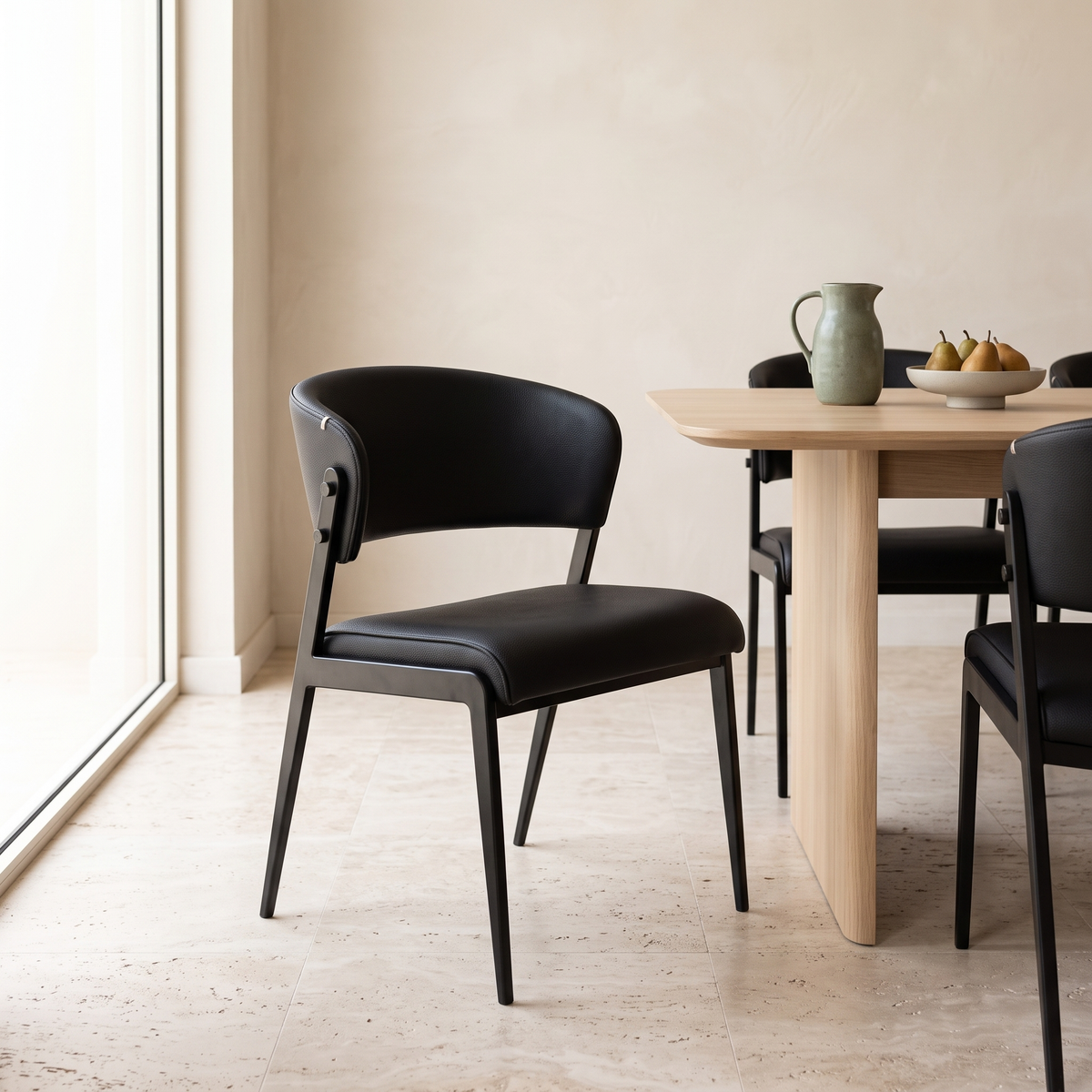 Noir Black Leather-Look Dining Chair in a Muscat home