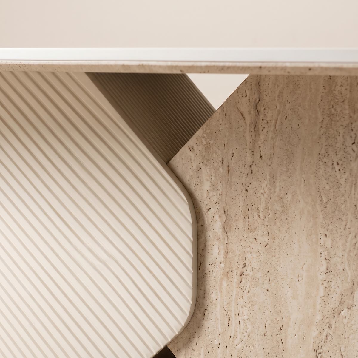 Detail of the travertine-look and diagonally ribbed table base