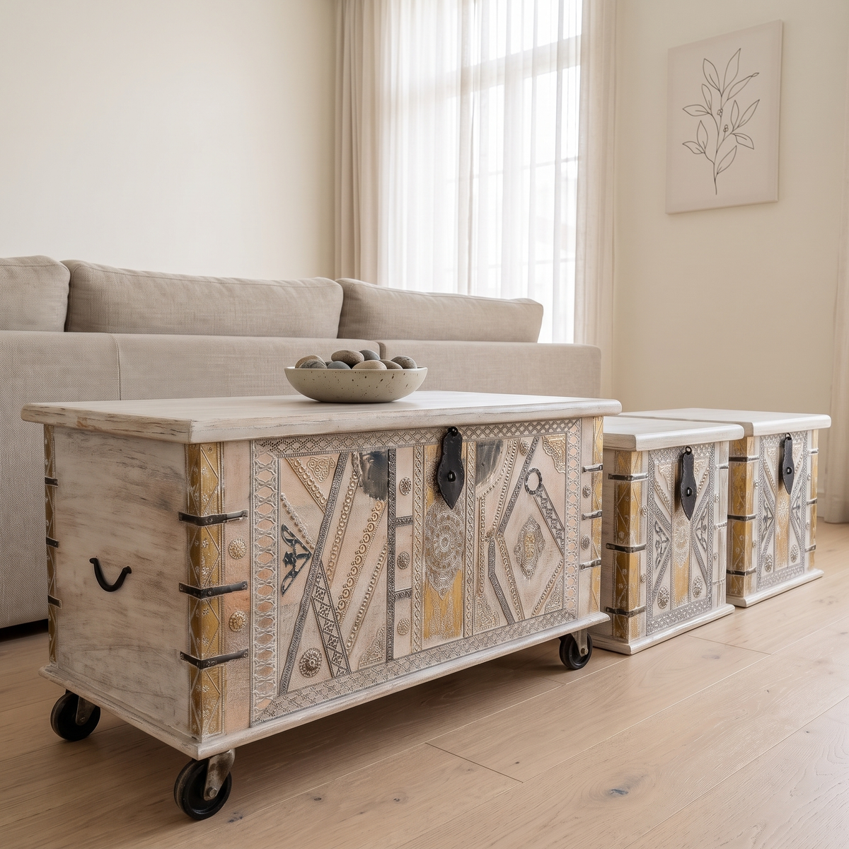 Accent chests used as a coffee table and side tables in front of a sofa