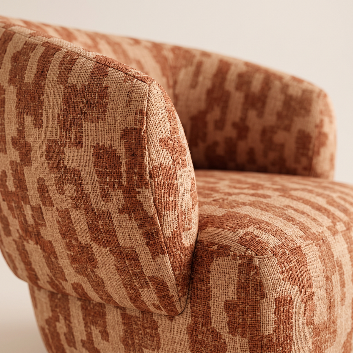 Detail of the terracotta and camel-beige woven upholstery