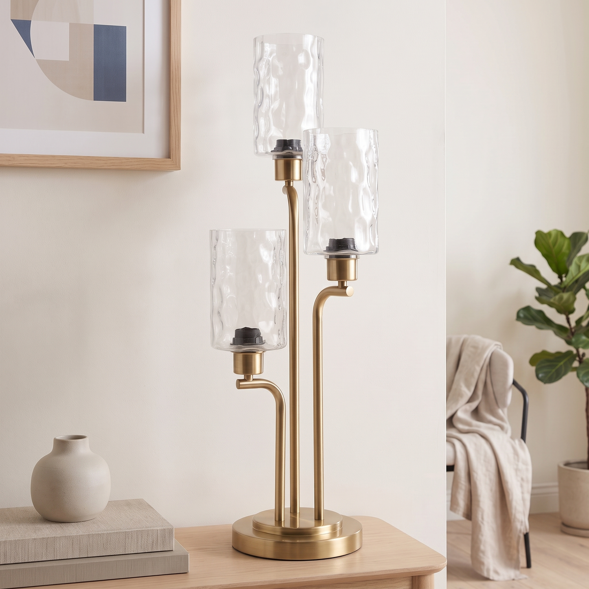 Three-Light Table Lamp #ML83537, closer angled view of the brass stems and glass shades