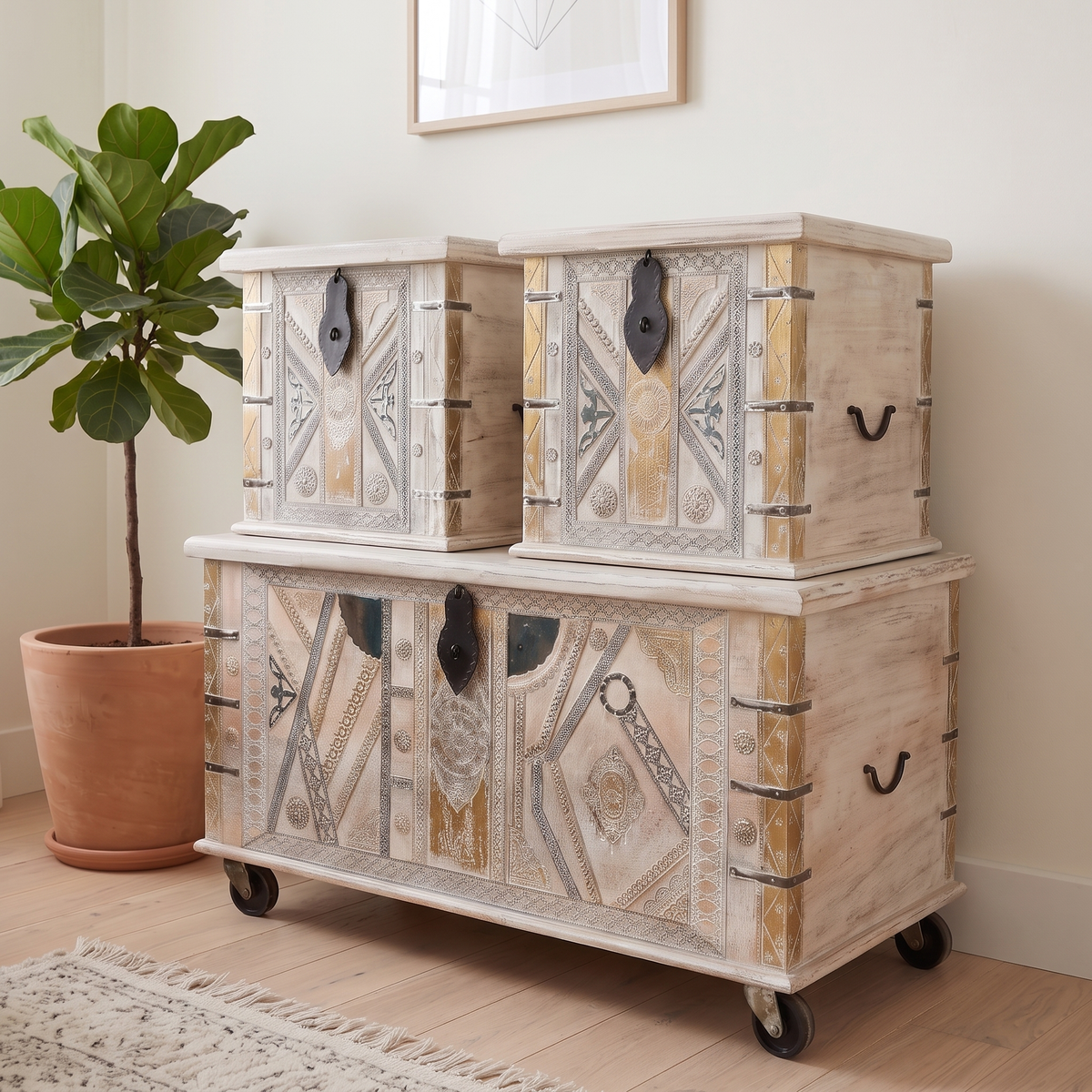 Close angled view of the stacked accent chests and embossed metalwork