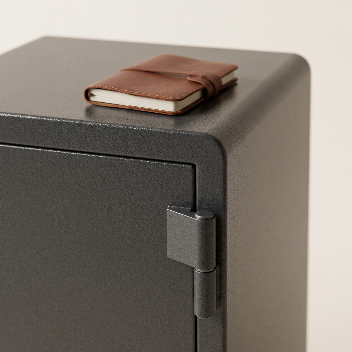 ExecutiveSafe Security Safe #ES060, door hinge detail with a leather notebook