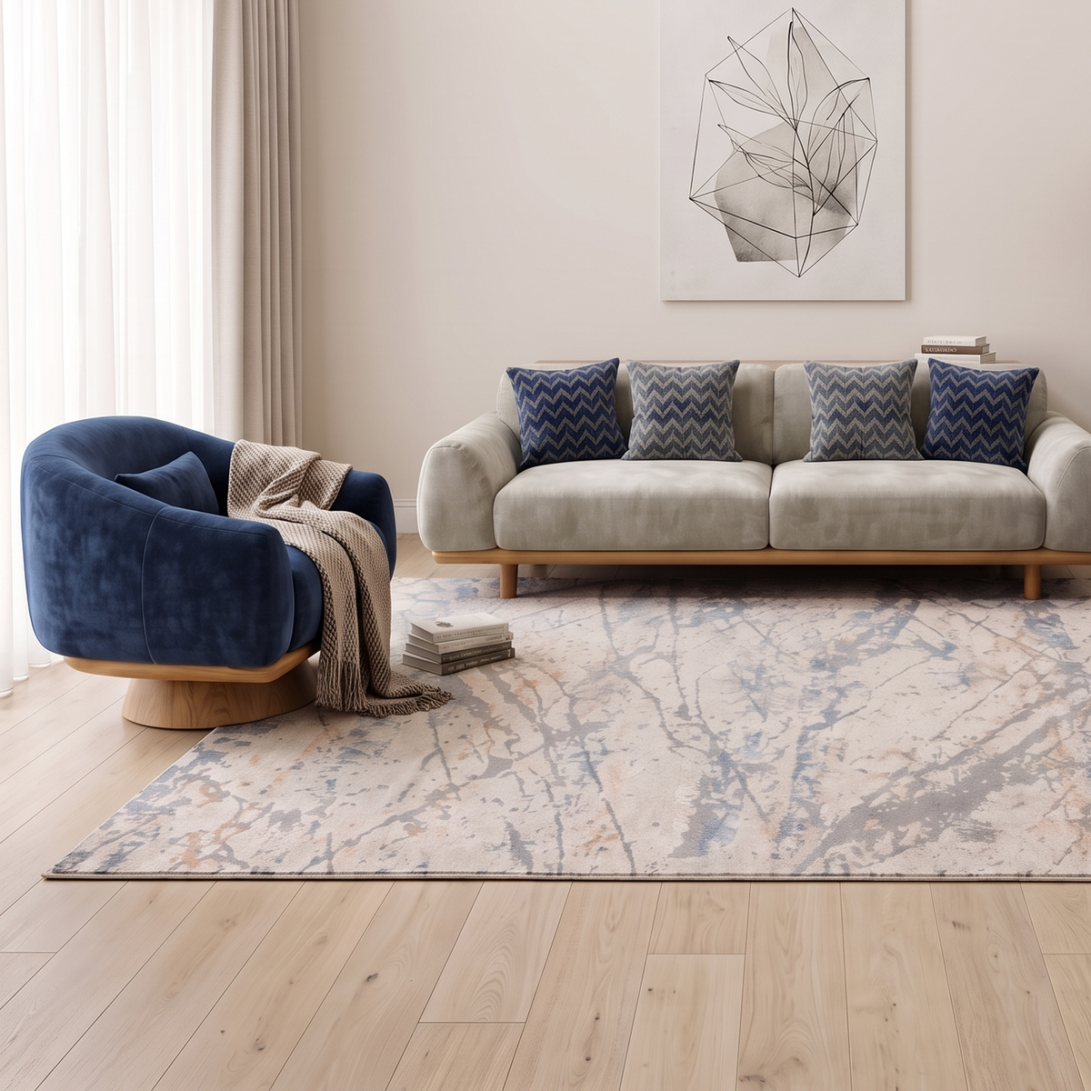 Closer view of the navy velvet armchair and grey-beige four seater sofa